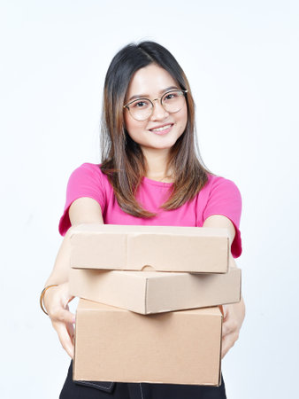 Holding Package Box or Cardboard Box Of Beautiful Asian Woman Isolated On White Backgroundの写真素材