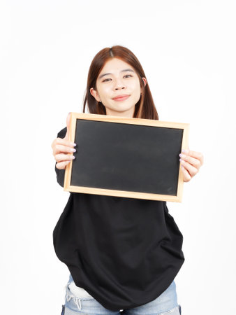 Showing, Presenting and holding Blank Blackboard Of Beautiful Asian Woman Isolated On Whiteの写真素材
