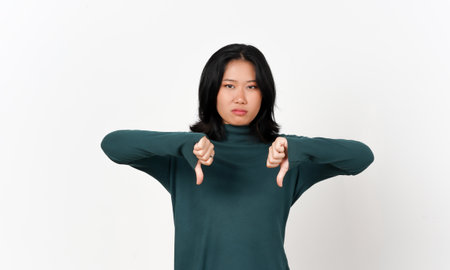 Showing Thumbs Down and Looking at Camera Of Beautiful Asian Woman Isolated On White Backgroundの写真素材