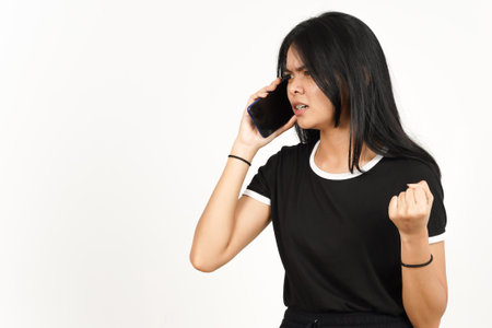 Make a Phone Call Using smartphone with angry face Of Beautiful Asian Woman Isolated On Whiteの写真素材