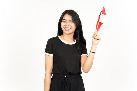 Smiling and Holding Indonesian Flag Of Beautiful Asian Woman Isolated On White Backgroundの写真素材