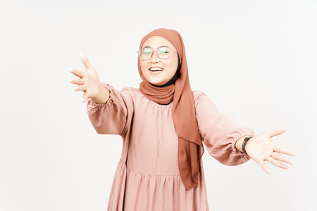 Offering hug of Beautiful Asian Woman Wearing Hijab Isolated On White Backgroundの写真素材