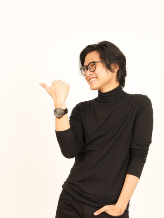 Presenting and Pointing Side Product Using Thumb Of Handsome Asian Man Isolated On White Backgroundの写真素材