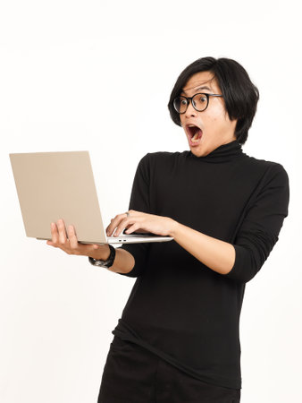 Shock and Angry While Using Laptop Of Handsome Asian Man Isolated On White Backgroundの写真素材