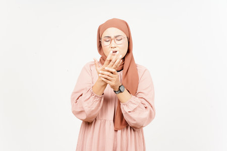 Suffering pain on hands of Beautiful Asian Woman Wearing Hijab Isolated On White Background