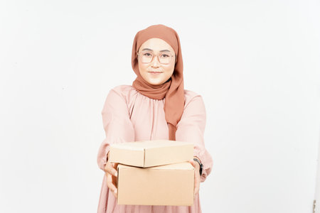 Holding Package Box or Cardboard Box of Beautiful Asian Woman Wearing Hijab Isolated On Whiteの写真素材