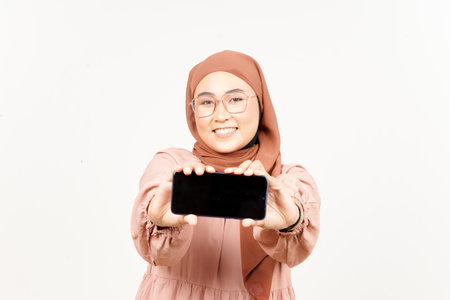 Showing Apps On Blank Screen Smartphone of Beautiful Asian Woman Wearing Hijab Isolated On Whiteの写真素材