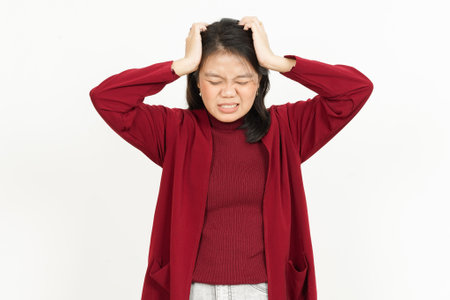 Headache Gesture Of Beautiful Asian Woman Wearing Red Shirt Isolated On White Backgroundの写真素材