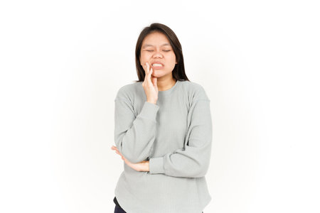 Toothache Gesture Of Beautiful Asian Woman Isolated On White Backgroundの写真素材