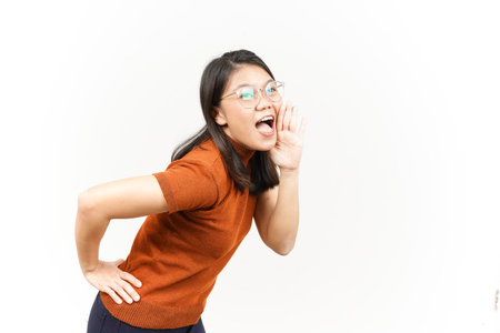 Shouting out loud with hands over mouth Of Beautiful Asian Woman Isolated On White Backgroundの写真素材