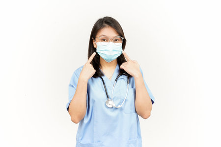 Wearing Mask Of Asian Young Doctor Isolated On White Backgroundの写真素材