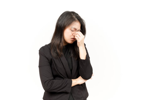 Suffering Headache Of Beautiful Asian Woman Wearing Black Blazer Isolated On White Backgroundの写真素材