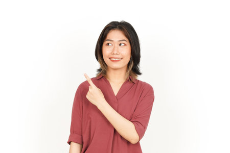 Showing and Pointing Product With Forefinger Of Beautiful Asian Woman Isolated On White Backgroundの写真素材