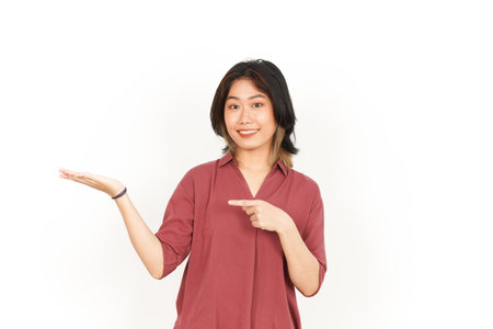 Showing and Presenting Product on Open Palm Of Beautiful Asian Woman Isolated On White Backgroundの写真素材
