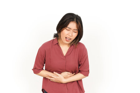 Suffering Stomachache Of Beautiful Asian Woman Isolated On White Backgroundの写真素材