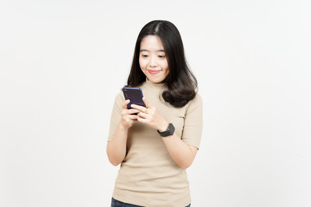 Holding or Using Smartphone and Smile Of Beautiful Asian Woman Isolated On White Backgroundの写真素材