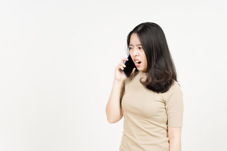 Asian woman talking on the phone on white background with copy space.の写真素材