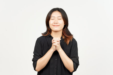 Smile closed eye and folding hand for pray of Beautiful Asian Woman Isolated On White Background