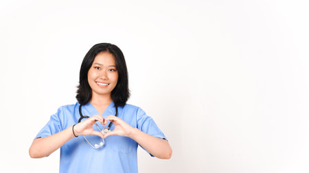 Young Asian female doctor showing love sign isolated on white backgroundの写真素材