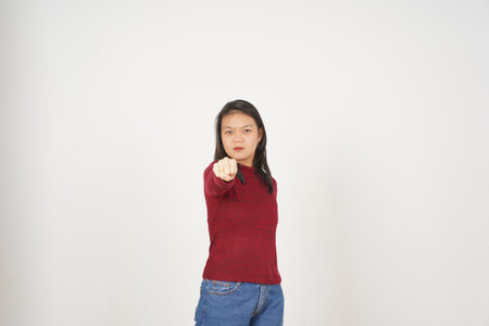 Young Asian woman in Red t-shirt Punching Fist to Fight isolated on white backgroundの写真素材