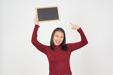 Young Asian woman in Red t-shirt Showing and holding black or chalk board sign isolated on white backgroundの写真素材