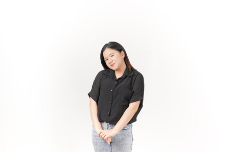 beautiful Asian woman smiles warmly, striking a cute, playful pose against a plain white background
