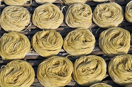 Nicely laid out pasta nests.の写真素材