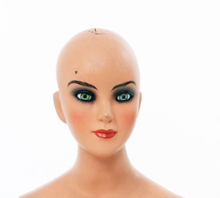  Portrait of an aged mannequin over white background.の写真素材