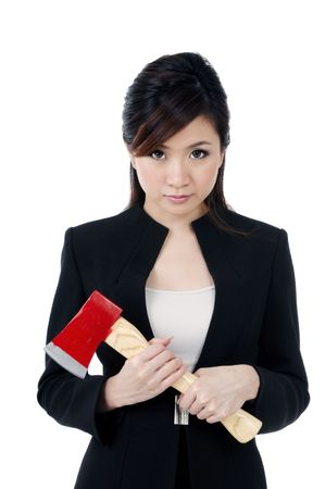 Portrait of a beautiful young businesswoman carrying an axe, over white background.の写真素材