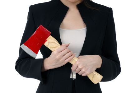 Close-up of a businesswoman carrying an axe, isolated on white.の写真素材
