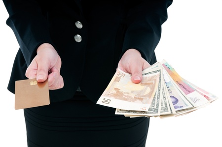 Close-up of a businesswoman holding credit card and money 