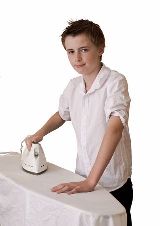 an image of a teenage school boy ironing wearing an unironed shirt, could portray irony.の写真素材