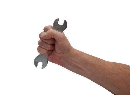 an isolated over white caucasian man's hand holding an open-ended old worn spanner.の写真素材