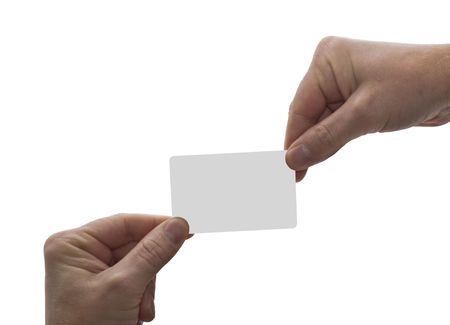 an isolated over white image of two caucasian men's hands exchanging a blank card, could be used for credit, payment, buisness etcの写真素材