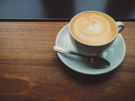 Cappuccino on a Wooden Tableの写真素材