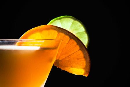 Lime and Orange Slice on a Cocktailの写真素材