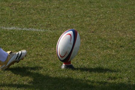 rugby player kicking ballの写真素材