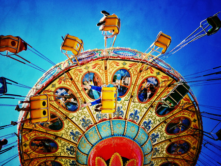 filtered image of an amusement park swing rideの写真素材