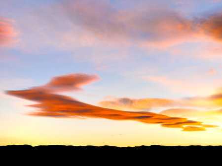 Vivid autumn sunset and odd cloud formations over Calf Creek, northern Grand Staircase Escalante,...