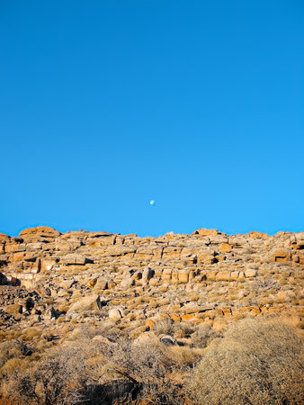 Late autumn in Zion Canyon, partial moon above ridgeの写真素材