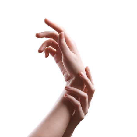 two perfect girls hands trying to feel the pulse isolated on white backgroundの写真素材