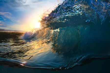 Beautiful ocean surfing shorebreak wave at sunset time