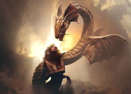 Blonde girl and dragon in fantasy world against brighr cloudy backgroundの写真素材