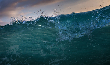 Front view of ocean wave. Sea pattern with Water drops shorebreak verticall wallの写真素材