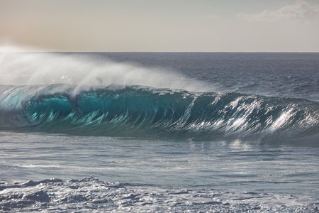 Blue ocean wave closing in lineの写真素材