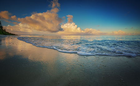 Sunrise scenery in tropical paradise. Maldivian sunrise ocean water with colorful clouds and ships on skyline backgroundの写真素材