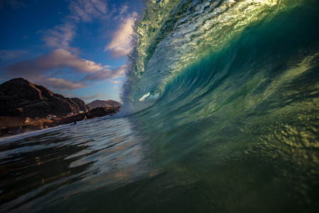 Vibrant green ocean wave rip curl insideの写真素材