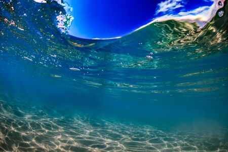 Surfing Clear Ocean wave underwater viewの写真素材