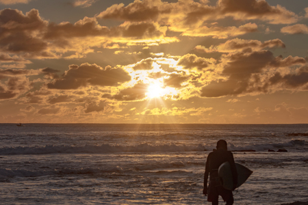 Seascape with surfing spots at sunset time in Pacific oceanの写真素材