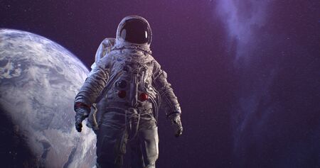 Astronaut Neil Armstrong, spacewalk on the Moon surface watching planet Earth from space.の写真素材